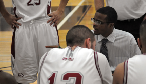 Kwantlen head coach Stefon Wilson addresses his players after calling a timeout midway through the third quarter